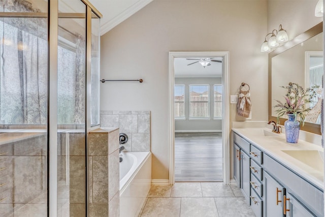 3515 Cactus Field Ln, Katy, TX 77449 - bathroom featuring a bath, double vanity, crown molding, a ceiling fan, and tile patterned floors