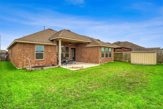 3515 Cactus Field Ln, Katy, TX 77449 - rear view of house featuring a fenced backyard, a patio area, brick siding, roof with shingles, and a ceiling fan