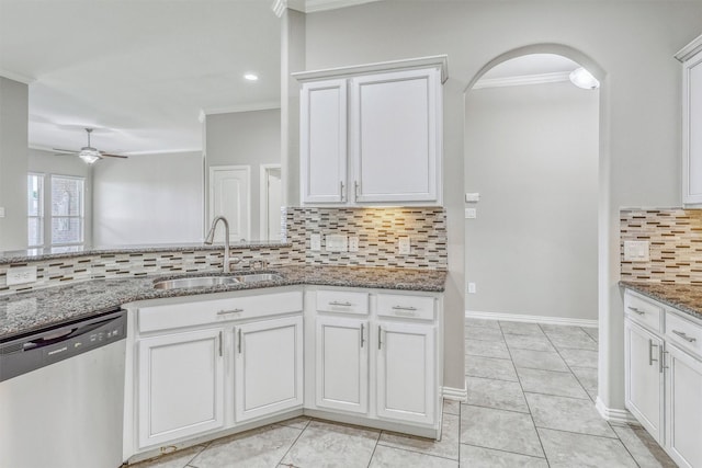 3515 Cactus Field Ln, Katy, TX 77449 - kitchen with stainless steel dishwasher, ornamental molding, backsplash, light stone countertops, and ceiling fan