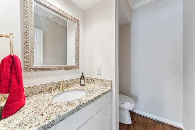 5082 Augusta St, Houston, TX 77007 - half bathroom with vanity, wood finished floors, and ornamental molding