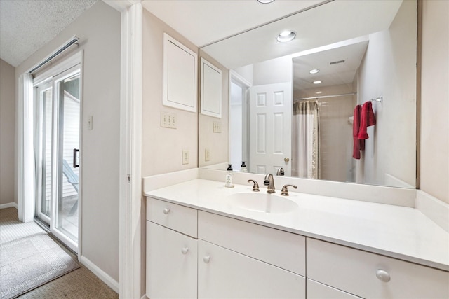 5082 Augusta St, Houston, TX 77007 - full bath with vanity, plenty of natural light, and a shower with shower curtain