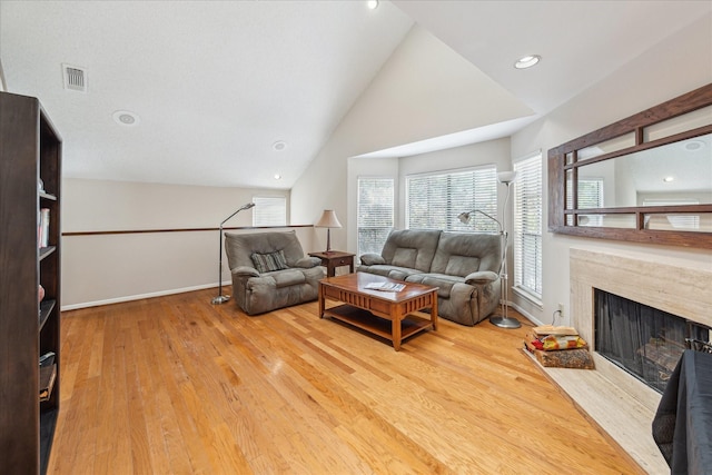5082 Augusta St, Houston, TX 77007 - living area with wood finished floors, a high end fireplace, and vaulted ceiling
