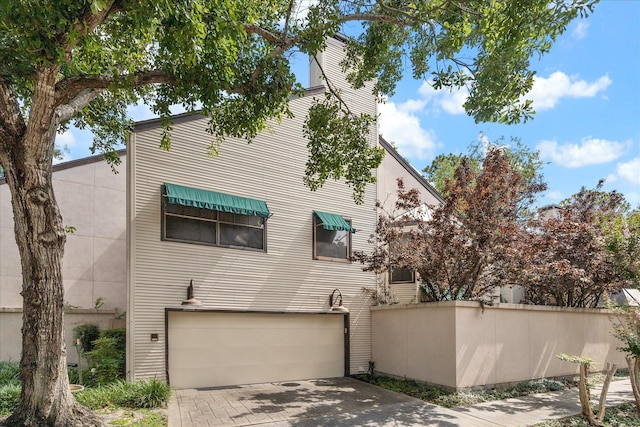 5082 Augusta St, Houston, TX 77007 - multi unit property with an attached garage and concrete driveway