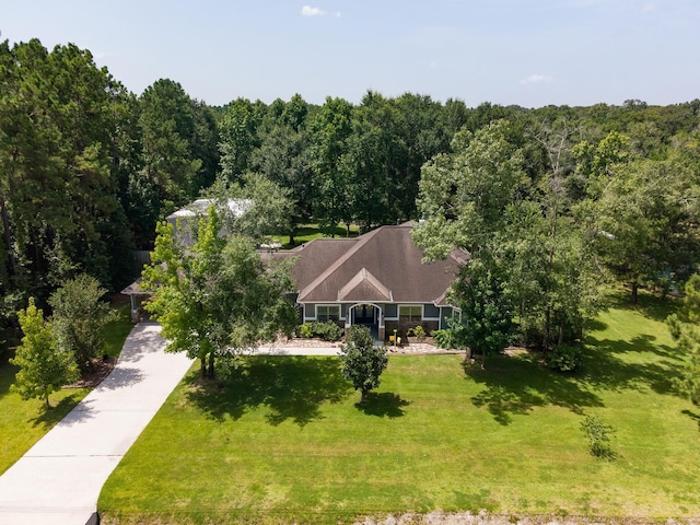 27724 Colapis Dr, Splendora, TX 77372 - view from above of property with a heavily wooded area
