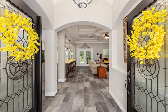 27724 Colapis Dr, Splendora, TX 77372 - entrance foyer with ornamental molding, a ceiling fan, coffered ceiling, arched walkways, and beam ceiling