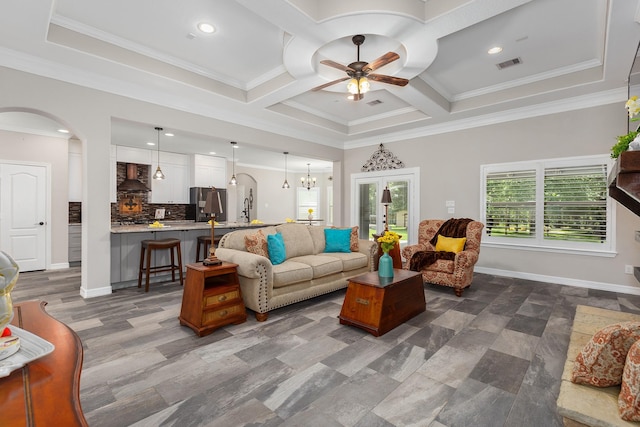 27724 Colapis Dr, Splendora, TX 77372 - living room with arched walkways, ceiling fan, coffered ceiling, crown molding, and recessed lighting