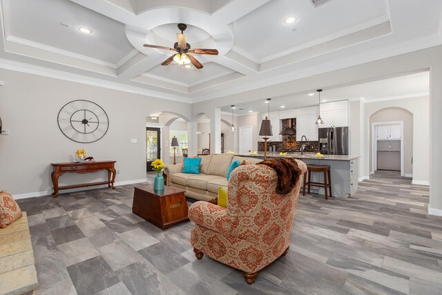 27724 Colapis Dr, Splendora, TX 77372 - living area featuring arched walkways, a ceiling fan, coffered ceiling, recessed lighting, and ornamental molding