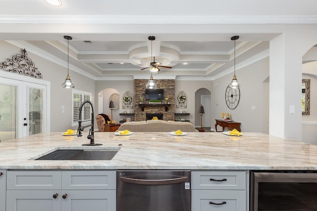 27724 Colapis Dr, Splendora, TX 77372 - kitchen featuring dishwasher, wine cooler, a ceiling fan, arched walkways, and open floor plan