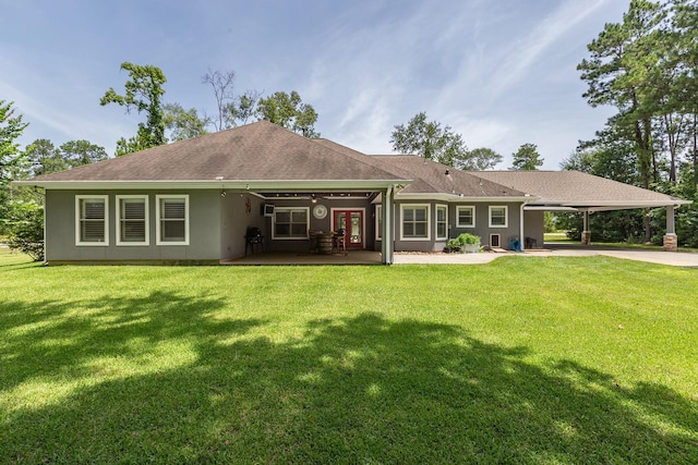 27724 Colapis Dr, Splendora, TX 77372 - rear view of house with a carport, stucco siding, a lawn, driveway, and a shingled roof
