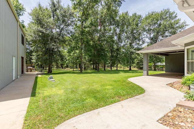 27724 Colapis Dr, Splendora, TX 77372 - view of green lawn with a patio