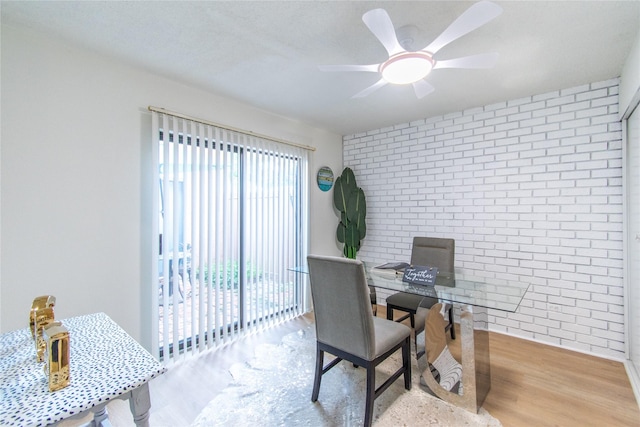 2429 Briarwest Blvd, Houston, TX 77077 - office with brick wall, wood finished floors, and ceiling fan