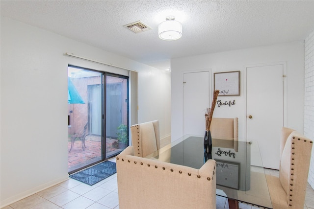 2429 Briarwest Blvd, Houston, TX 77077 - dining area featuring a textured ceiling and light tile patterned flooring