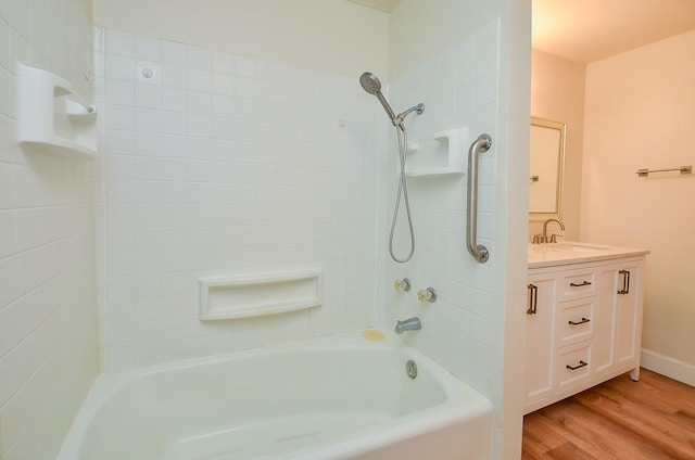 1700 Marilyn St, Rosenberg, TX 77471 - bathroom with wood finished floors, shower / bathtub combination, and vanity