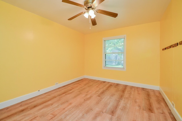 1700 Marilyn St, Rosenberg, TX 77471 - empty room with light wood finished floors and a ceiling fan