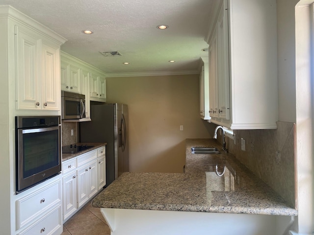 6220 Queenswood Ln, Houston, TX 77008 - kitchen featuring stainless steel appliances, tasteful backsplash, stone counters, crown molding, and recessed lighting