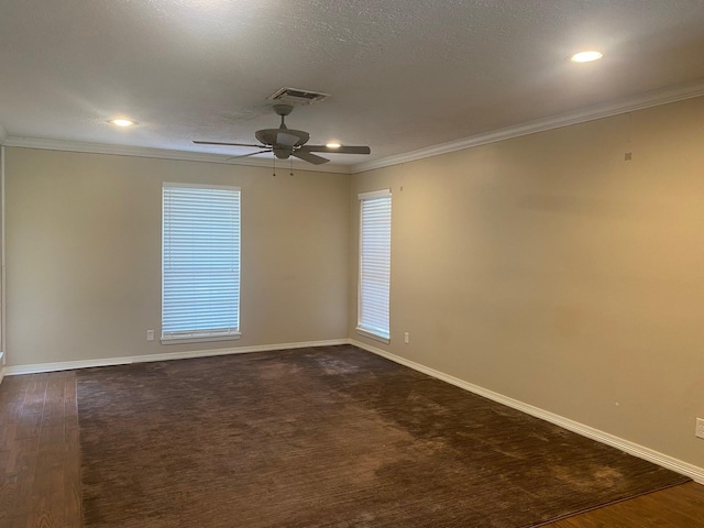 6220 Queenswood Ln, Houston, TX 77008 - spare room featuring ornamental molding, a ceiling fan, dark wood-style floors, and recessed lighting