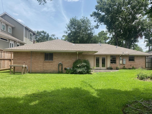 6220 Queenswood Ln, Houston, TX 77008 - rear view of property featuring french doors, brick siding, and roof with shingles