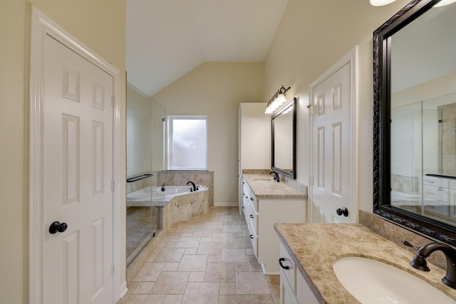 5022 Coral Gables Dr, Houston, TX 77069 - full bathroom with a garden tub, stone tile flooring, two vanities, vaulted ceiling, and a stall shower