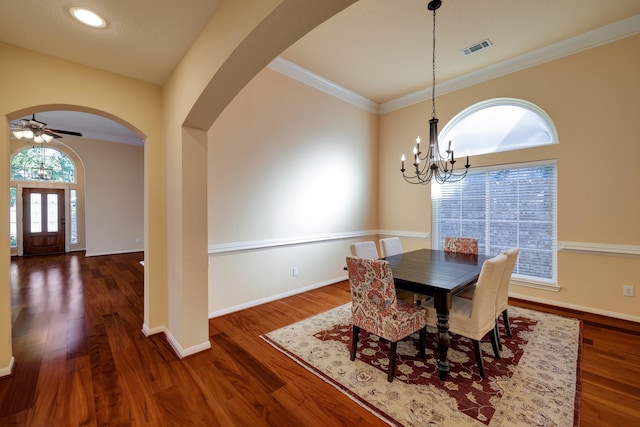 5022 Coral Gables Dr, Houston, TX 77069 - dining space with arched walkways, a chandelier, wood finished floors, ornamental molding, and ceiling fan