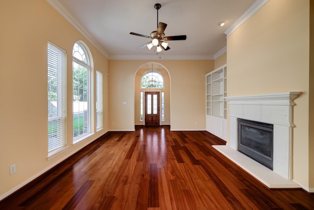 5022 Coral Gables Dr, Houston, TX 77069 - entryway with plenty of natural light, ornamental molding, a fireplace, wood finished floors, and ceiling fan