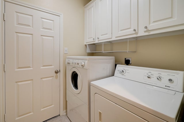 5022 Coral Gables Dr, Houston, TX 77069 - washroom with cabinet space and washer and clothes dryer
