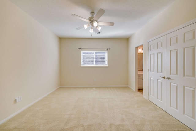 5022 Coral Gables Dr, Houston, TX 77069 - unfurnished bedroom featuring light carpet, a closet, ceiling fan, and ensuite bath