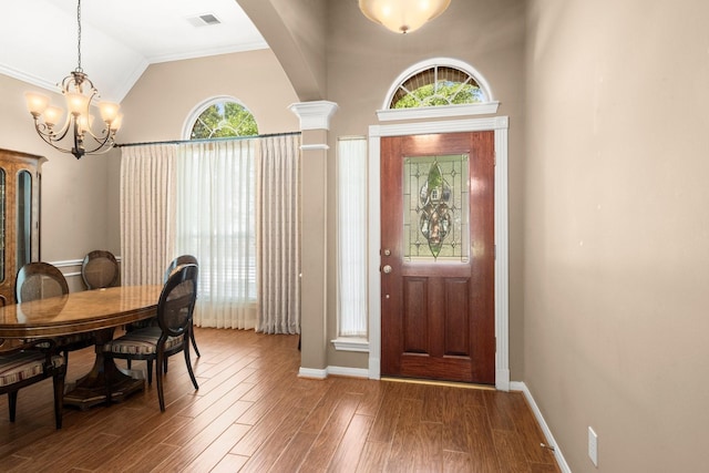 31406 Spica St, Tomball, TX 77375 - foyer featuring a chandelier, lofted ceiling, and wood finished floors