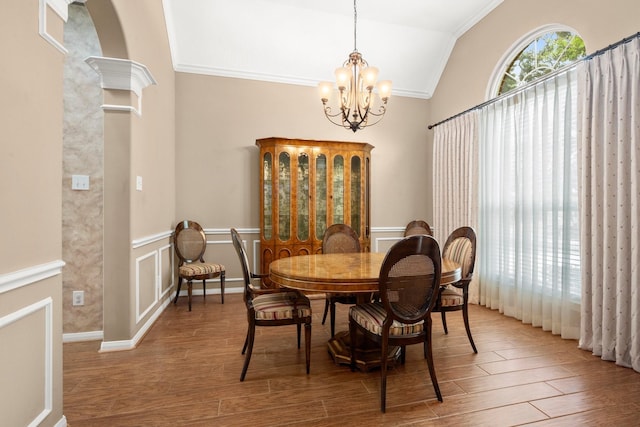 31406 Spica St, Tomball, TX 77375 - dining space with crown molding, a chandelier, wood finished floors, and vaulted ceiling