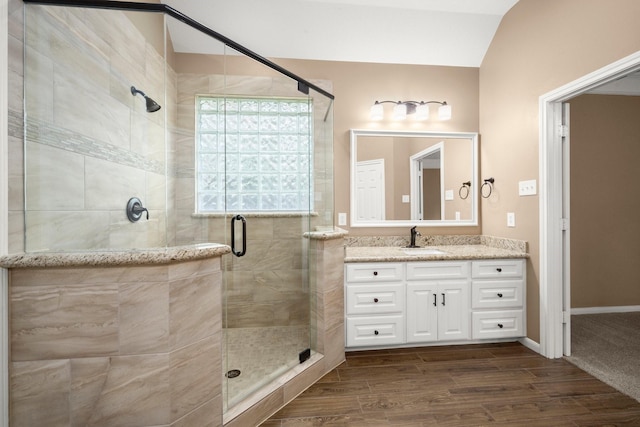 31406 Spica St, Tomball, TX 77375 - bathroom featuring vanity, a shower stall, and wood finished floors