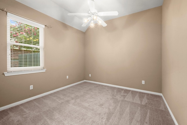 31406 Spica St, Tomball, TX 77375 - spare room featuring a ceiling fan, carpet floors, and vaulted ceiling