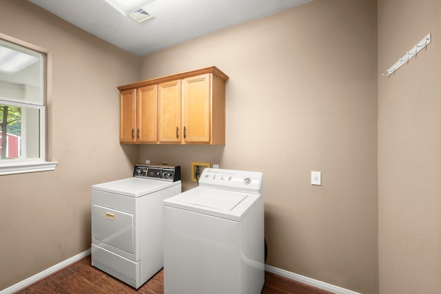 31406 Spica St, Tomball, TX 77375 - washroom with independent washer and dryer, cabinet space, and dark wood-style flooring