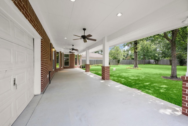 31406 Spica St, Tomball, TX 77375 - fenced backyard featuring a ceiling fan and a patio