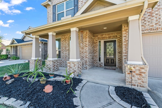 24111 Auburn Woods Ct, Porter, TX 77365 - entrance to property with a porch, an attached garage, and brick siding