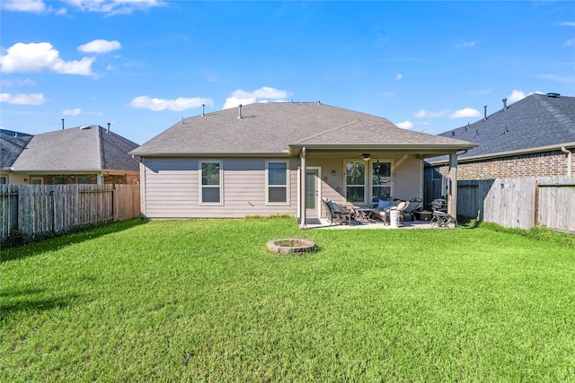 24111 Auburn Woods Ct, Porter, TX 77365 - rear view of property featuring a fenced backyard, a ceiling fan, a patio area, and a fire pit
