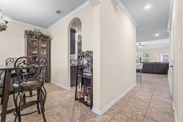 24111 Auburn Woods Ct, Porter, TX 77365 - hallway featuring arched walkways, ornamental molding, recessed lighting, and light tile patterned floors