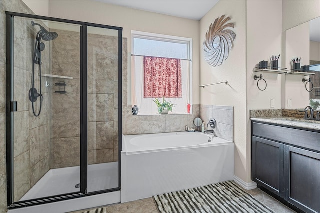 24111 Auburn Woods Ct, Porter, TX 77365 - full bath featuring a garden tub, a stall shower, vanity, and tile patterned floors