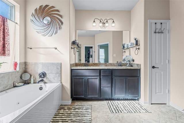 24111 Auburn Woods Ct, Porter, TX 77365 - bathroom with double vanity, a whirlpool tub, healthy amount of natural light, and tile patterned floors