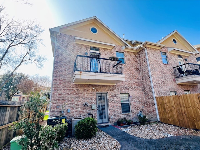 8018 Stoneyway Dr, Houston, TX 77040 - view of front facade featuring a balcony and brick siding