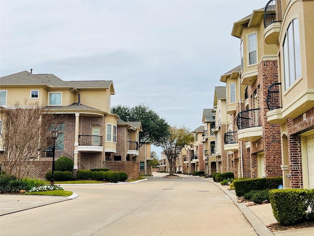 8018 Stoneyway Dr, Houston, TX 77040 - view of concrete road featuring curbs and a residential view