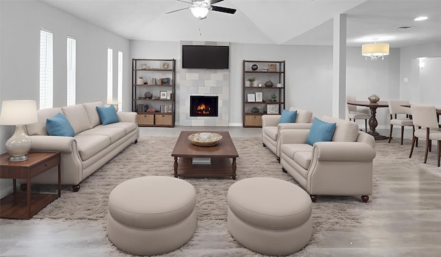 2414 Stillmeadow Dr, Missouri City, TX 77489 - living room with a ceiling fan, wood finished floors, a fireplace, built in features, and vaulted ceiling