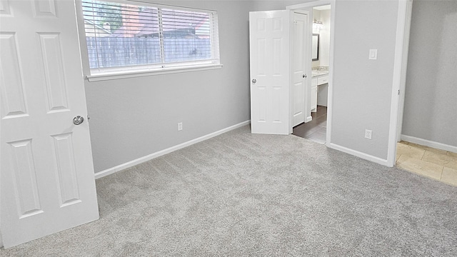 2414 Stillmeadow Dr, Missouri City, TX 77489 - unfurnished bedroom featuring carpet and connected bathroom