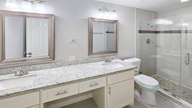 2414 Stillmeadow Dr, Missouri City, TX 77489 - full bathroom featuring double vanity, a shower stall, and tile patterned floors
