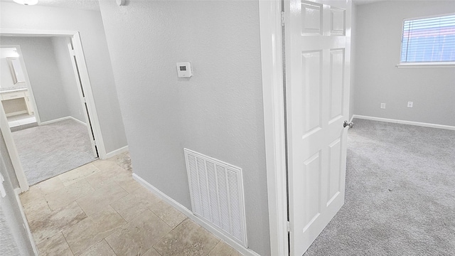 2414 Stillmeadow Dr, Missouri City, TX 77489 - hall featuring light colored carpet and stone tile floors