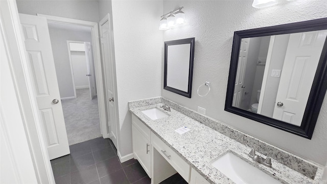 2414 Stillmeadow Dr, Missouri City, TX 77489 - bathroom with double vanity and tile patterned floors
