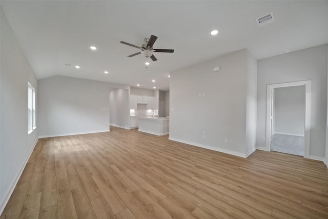 2556 Newport Breeze Dr, Katy, TX 77493 - unfurnished living room with ceiling fan, light wood-style flooring, recessed lighting, and vaulted ceiling