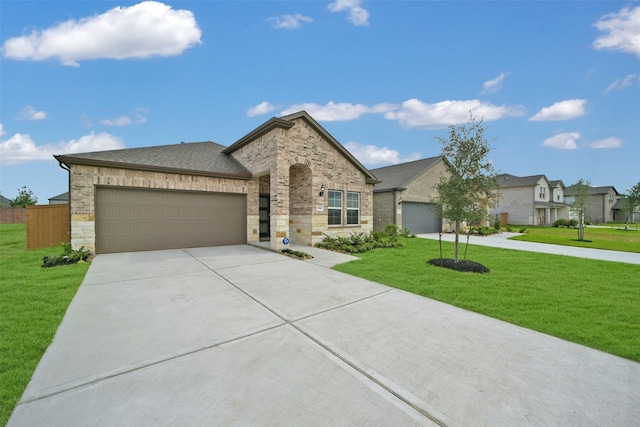 2556 Newport Breeze Dr, Katy, TX 77493 - french country home featuring driveway, a garage, a front yard, and stone siding