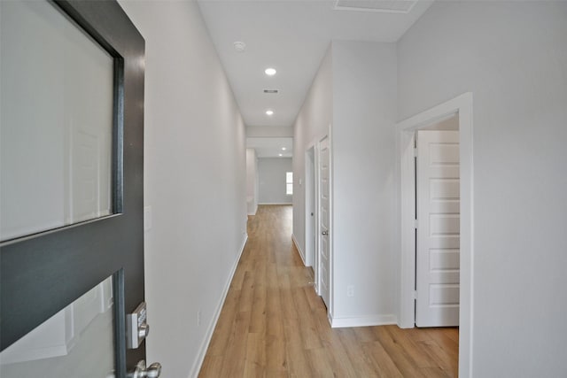 2556 Newport Breeze Dr, Katy, TX 77493 - hallway featuring light wood finished floors and recessed lighting