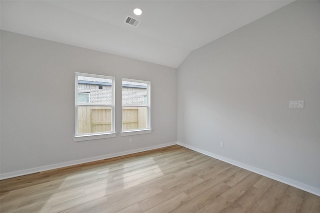 2556 Newport Breeze Dr, Katy, TX 77493 - empty room featuring light wood-style floors and vaulted ceiling