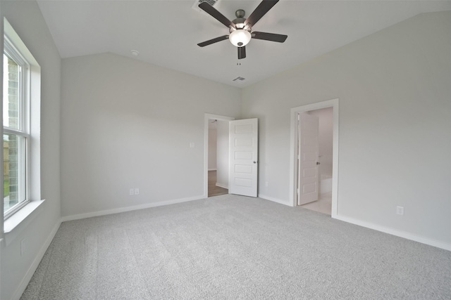 2556 Newport Breeze Dr, Katy, TX 77493 - unfurnished bedroom with carpet, connected bathroom, vaulted ceiling, and a ceiling fan
