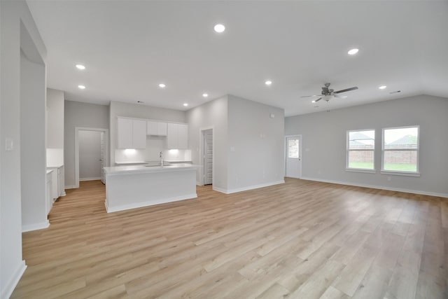 2556 Newport Breeze Dr, Katy, TX 77493 - unfurnished living room featuring recessed lighting, light wood-style flooring, and a ceiling fan
